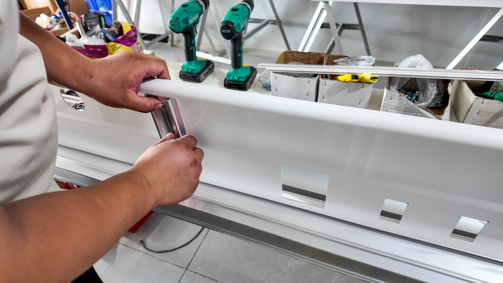 Securing the short accessory rail to the front panel.