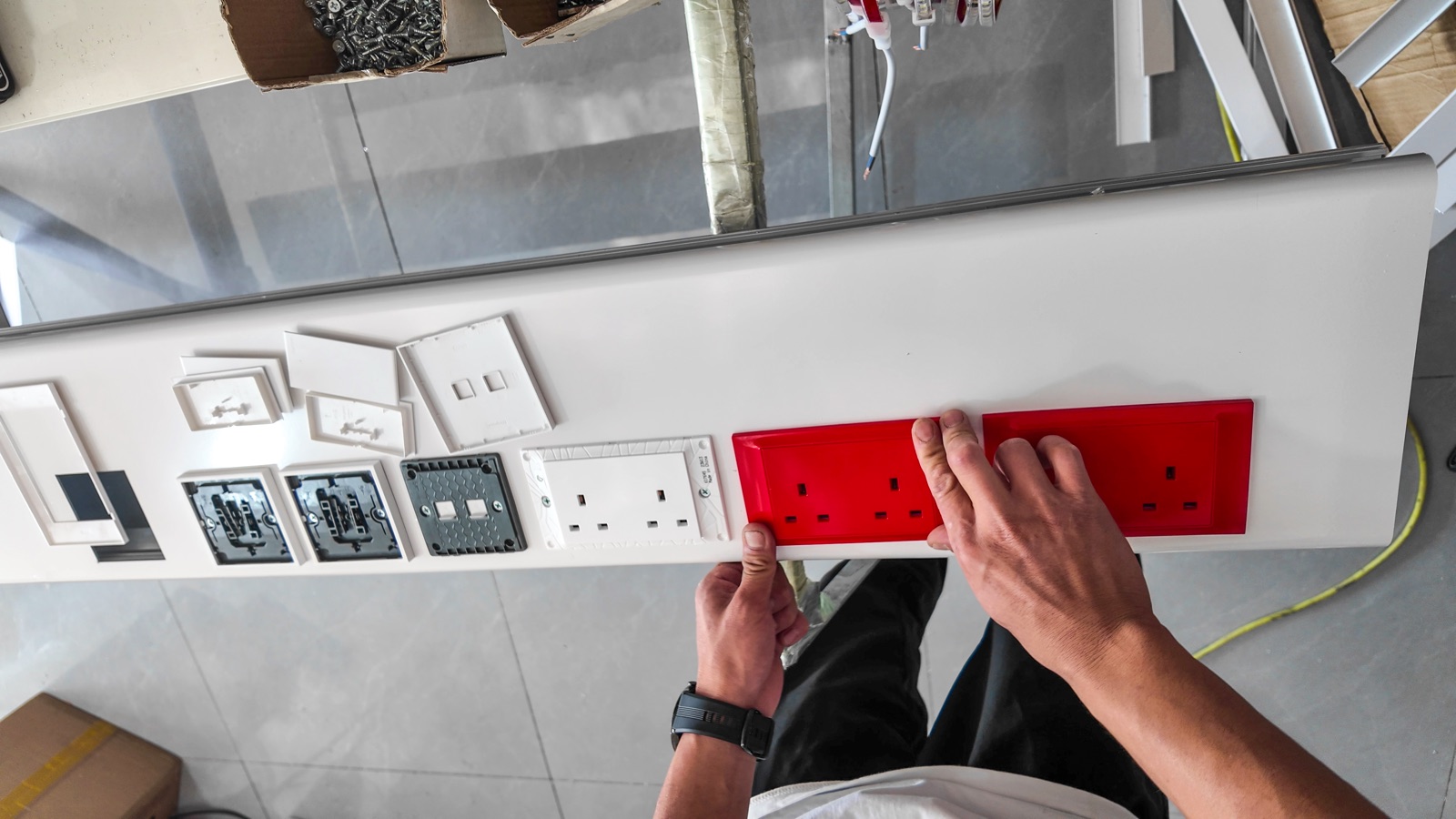 Fitting the red socket faceplates.