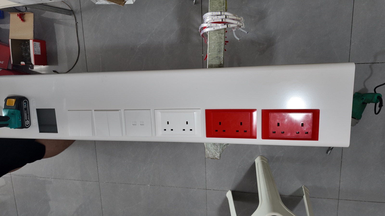 Electrical modules and socket faceplates in place.