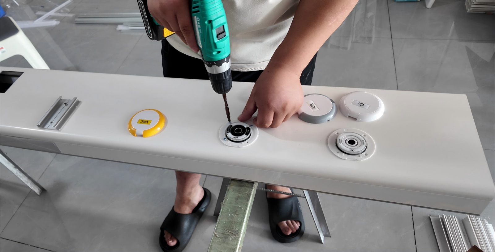 Securing the gas terminal surrounds and fitting the identification covers.