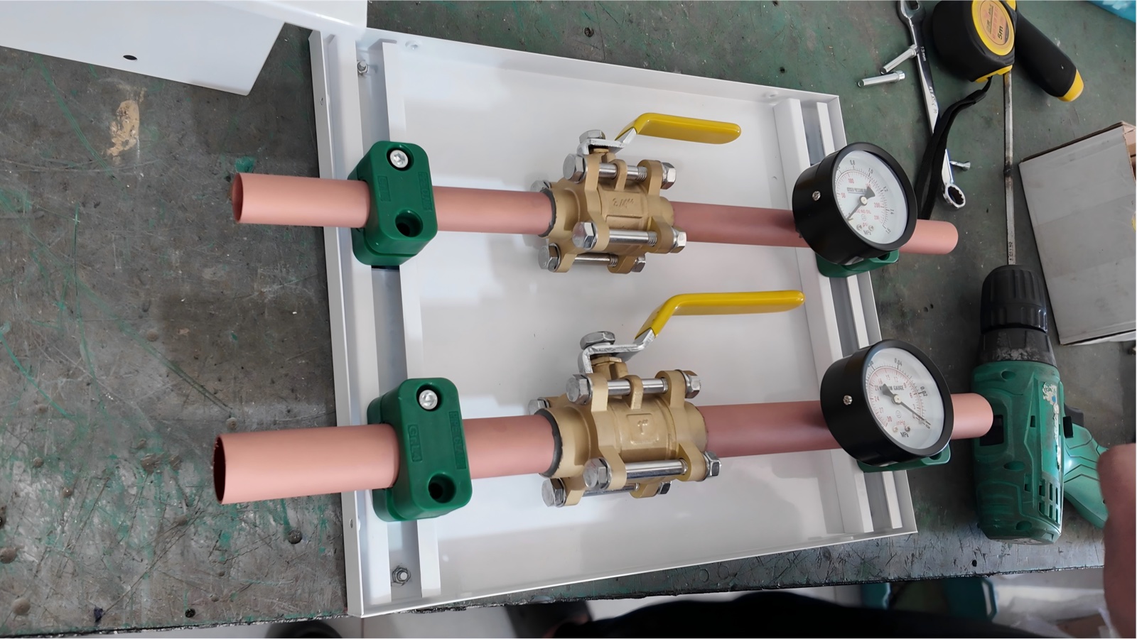 Fitting the second gas line with its ball valve, pipe clamp and pressure gauge.