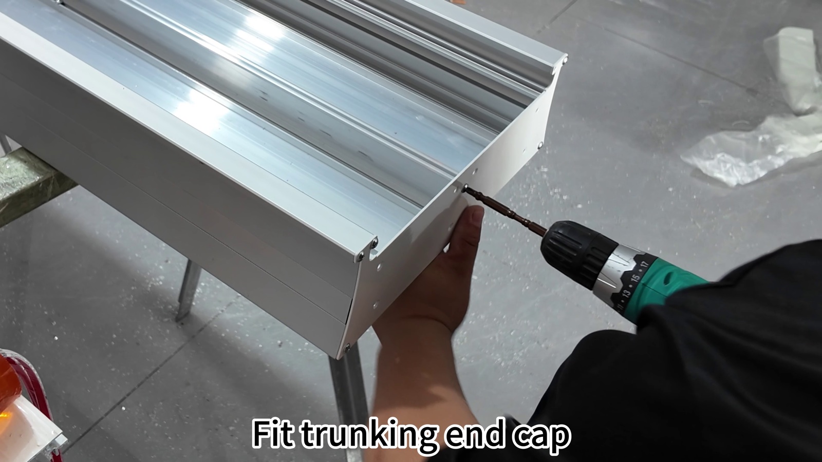 Fitting the trunking end cap on the housing of the Bed Head Unit 307.