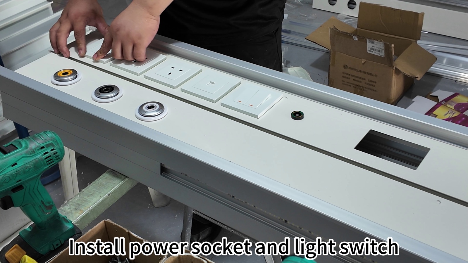 Setting the socket and switch modules into the face panel.