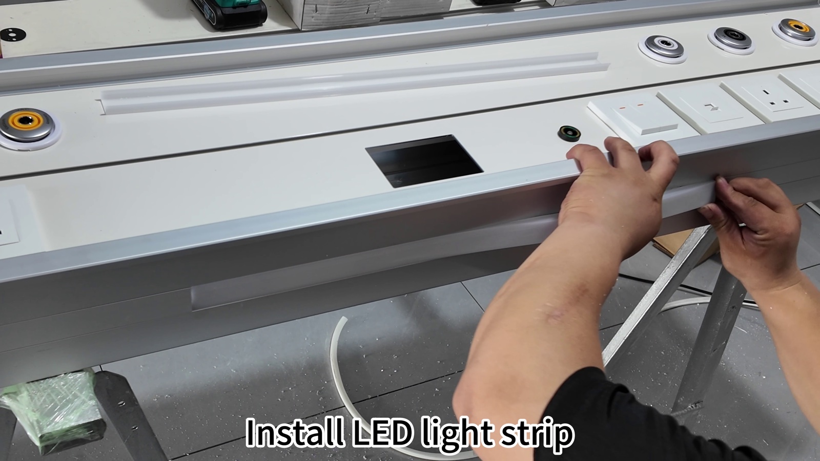 Laying the LED light strip into the lighting channel.