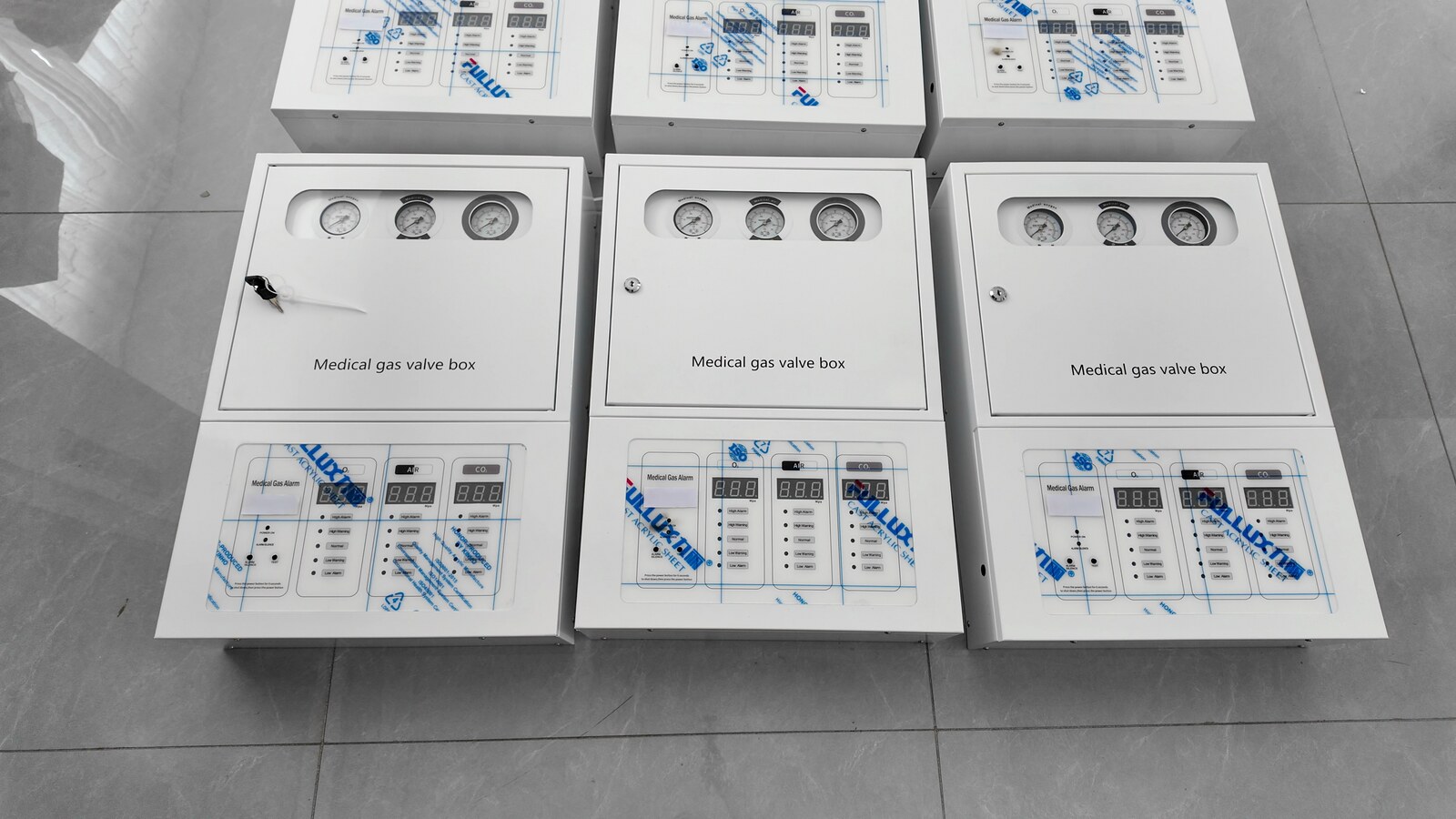 Finished GVB-7 medical gas valve boxes from the 10-unit shipment. The photograph shows part of the batch.