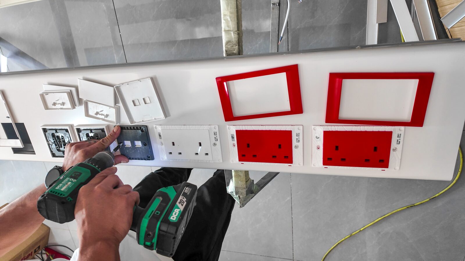 Electrical and control modules being fitted to a bed head unit panel