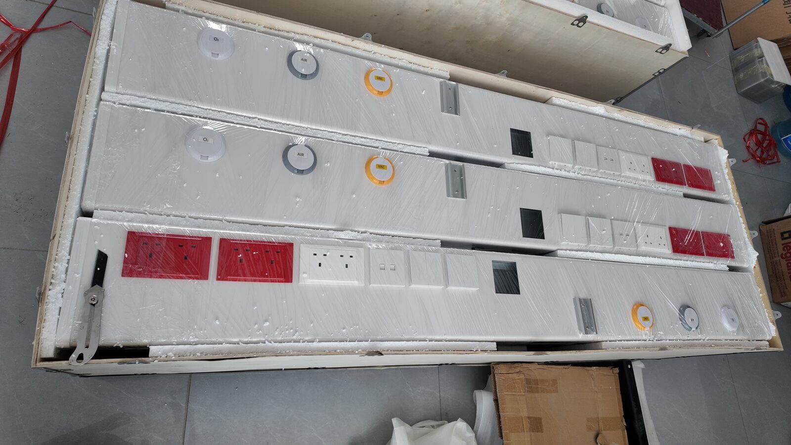 Bed head units arranged inside a protective wooden crate
