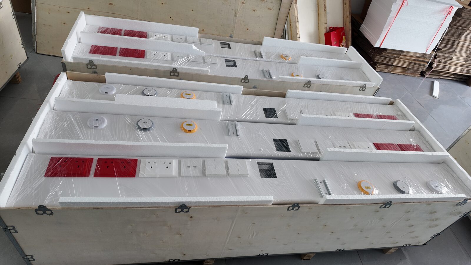 Bed head units with protective packing inside a wooden crate