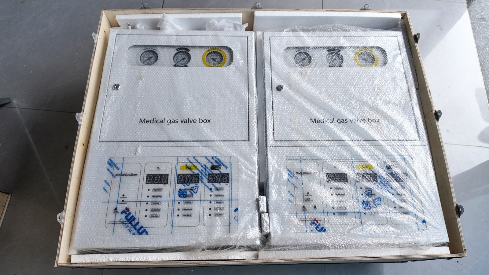 Two wrapped GVB-7 cabinets inside the crate before closure.