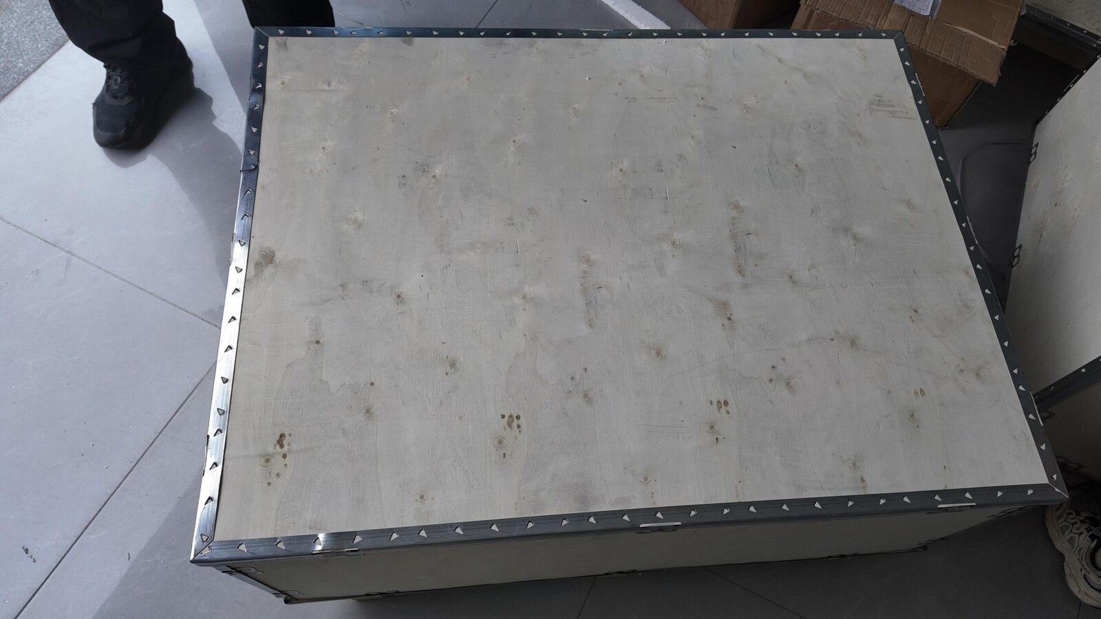 The closed wooden crate prepared for dispatch.