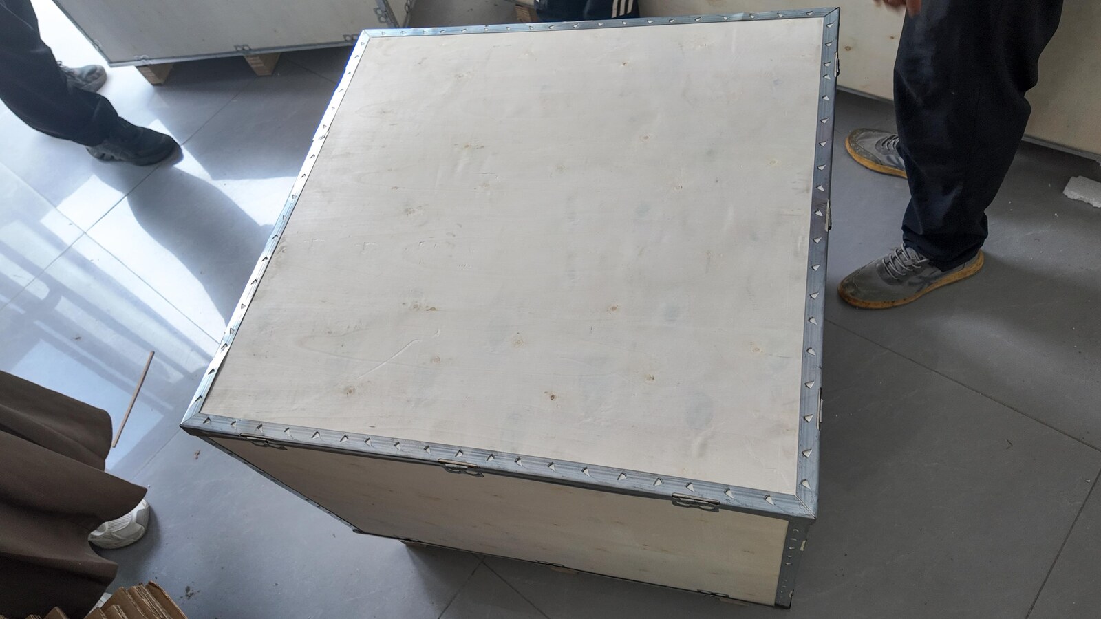 The closed crate from another angle during the packing stage.