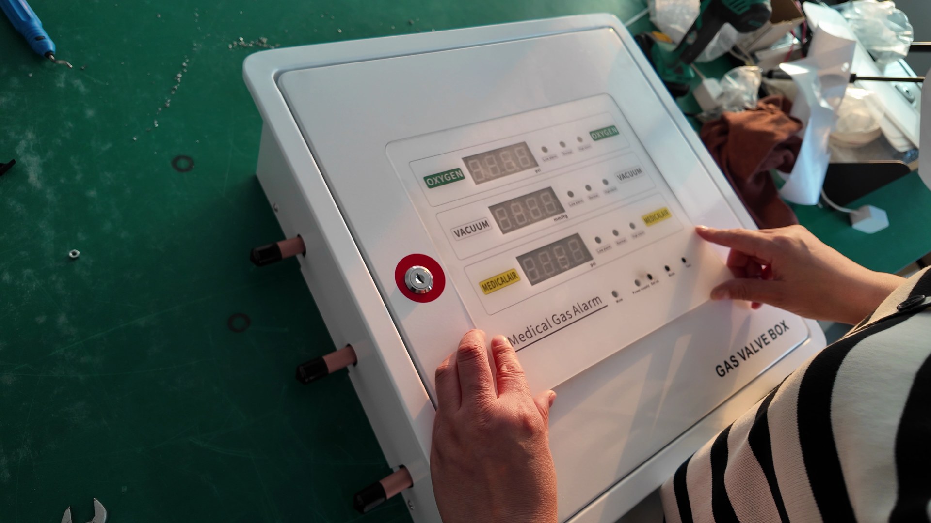 Fitting the labelled medical gas alarm front panel