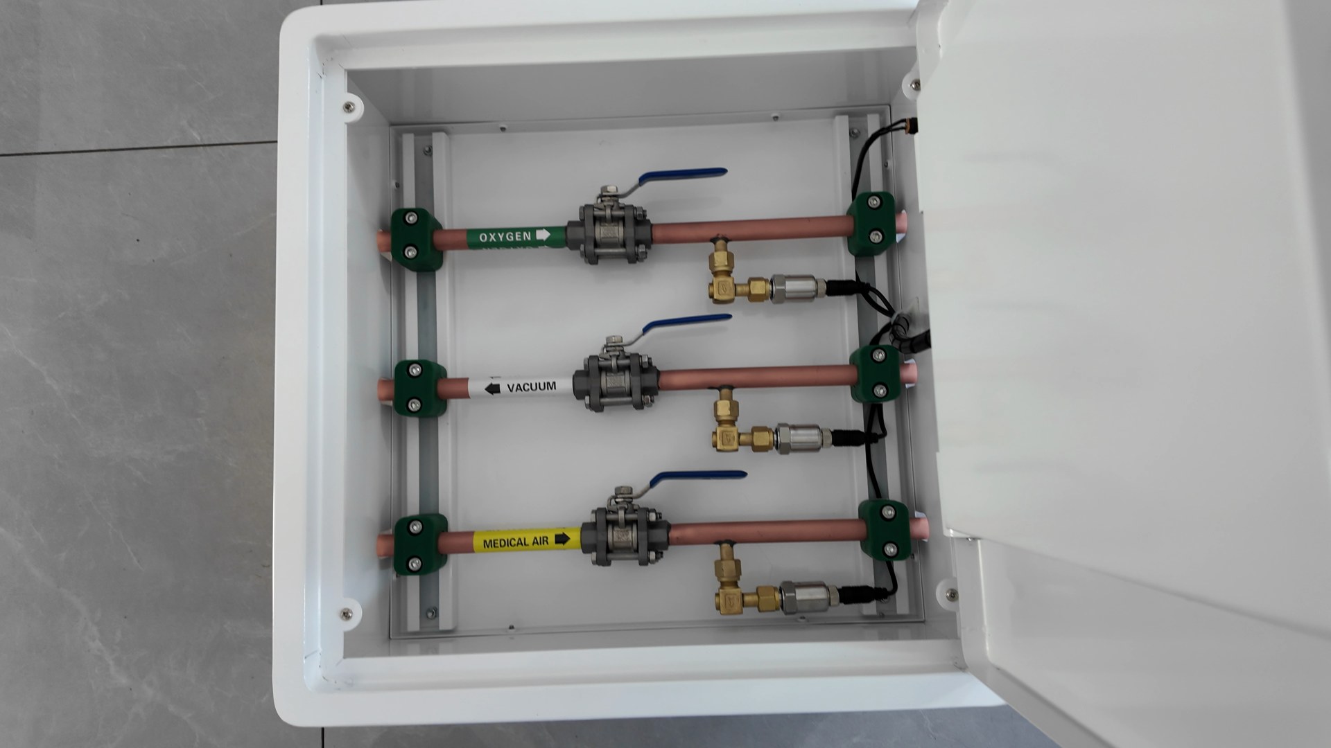 Open GVB-3 cabinet showing oxygen vacuum and medical air valve assemblies