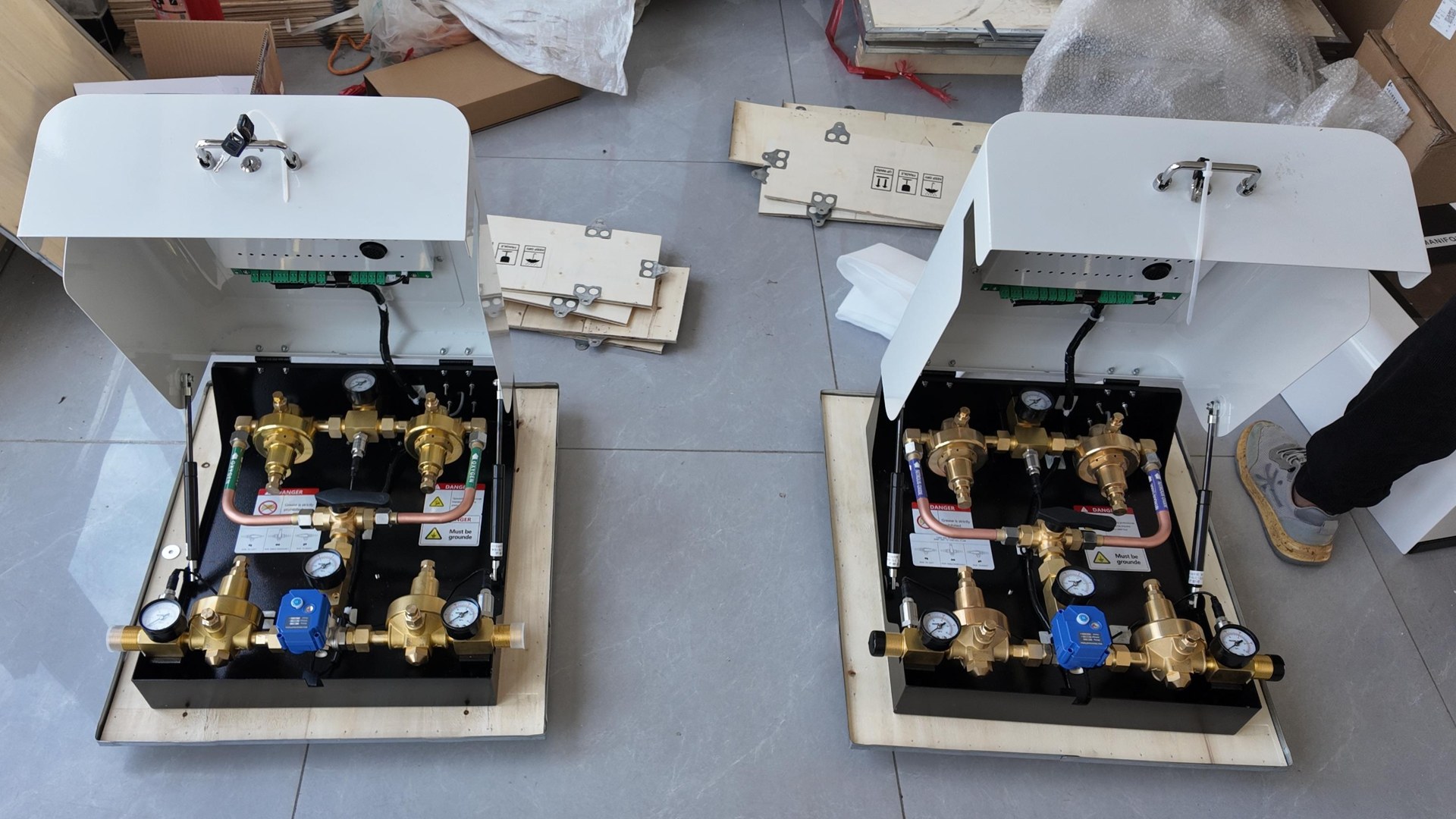 Two automatic manifold units with the covers raised