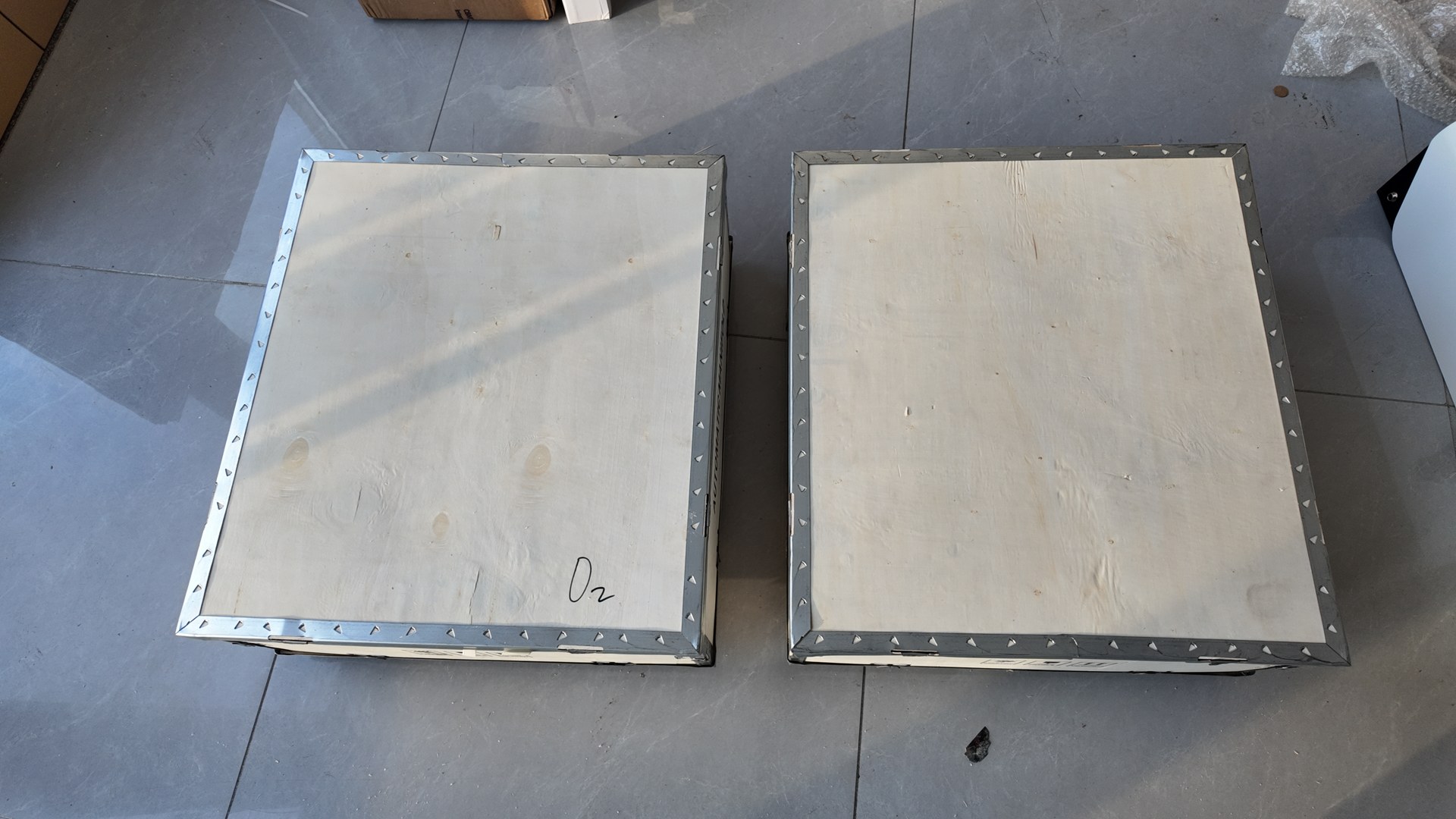 Two closed wooden packing cases